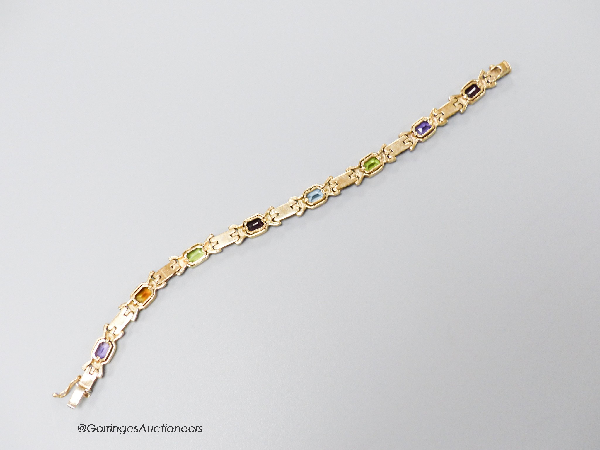 A modern 9ct gold and multi gem set bracelet, 18.4cm, gross weight 15.5 grams.